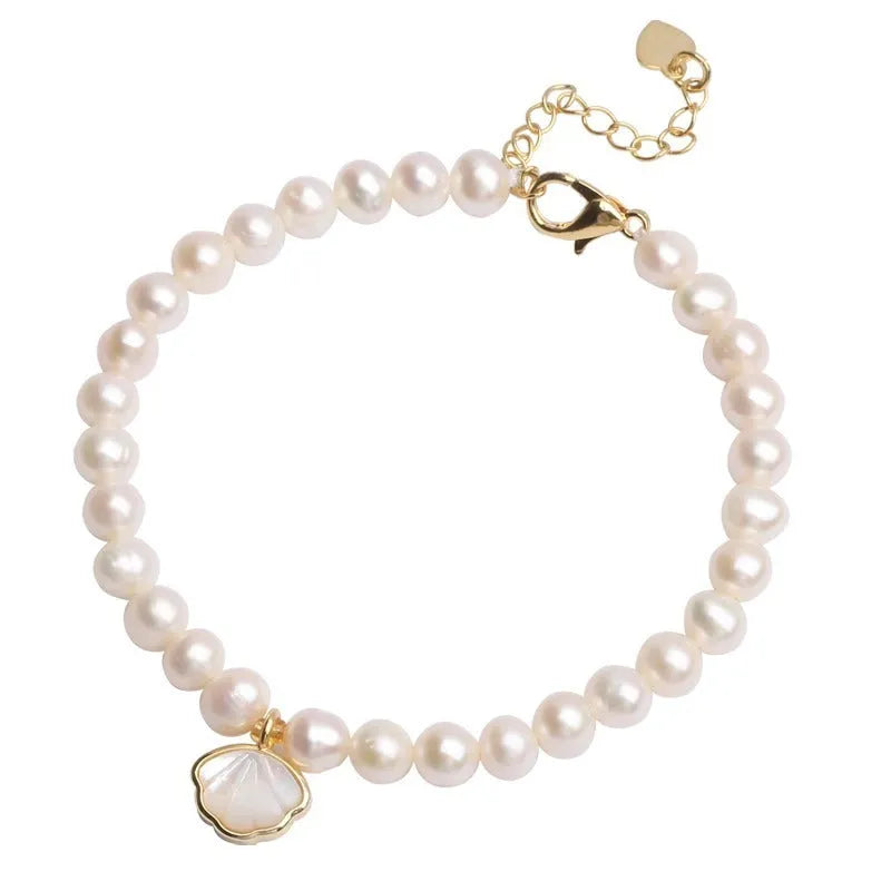 Women's freshwater pearl bracelet with fan-shaped alloy clasp, shown with both elastic and chain fastening options.