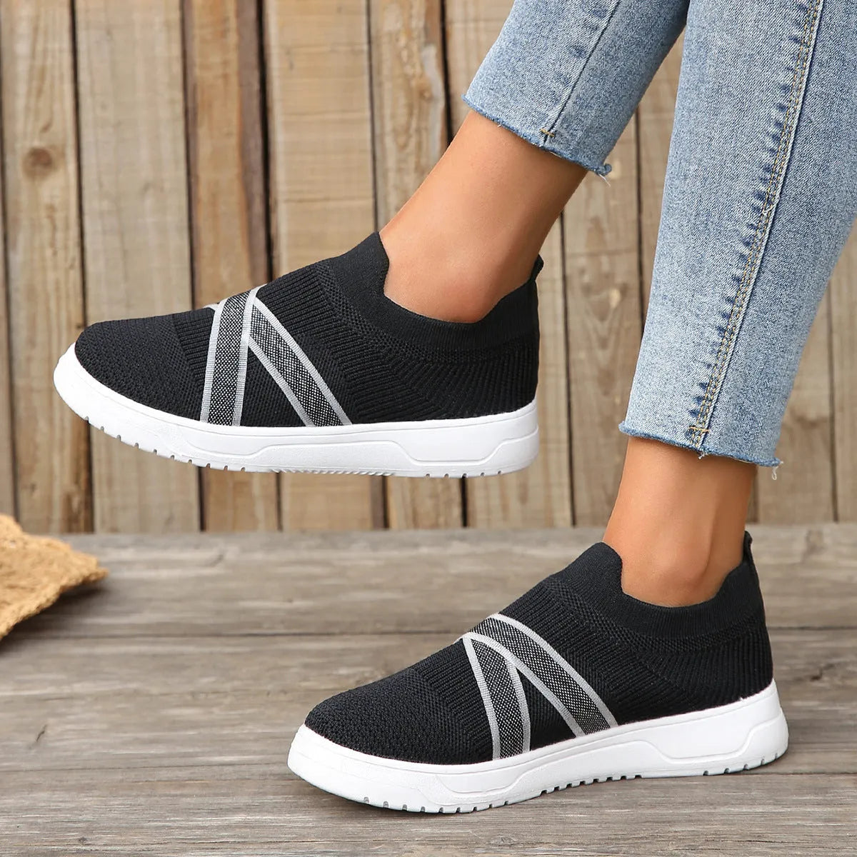 Black women's flat mesh shoes with flyknit fabric upper and tassel detail