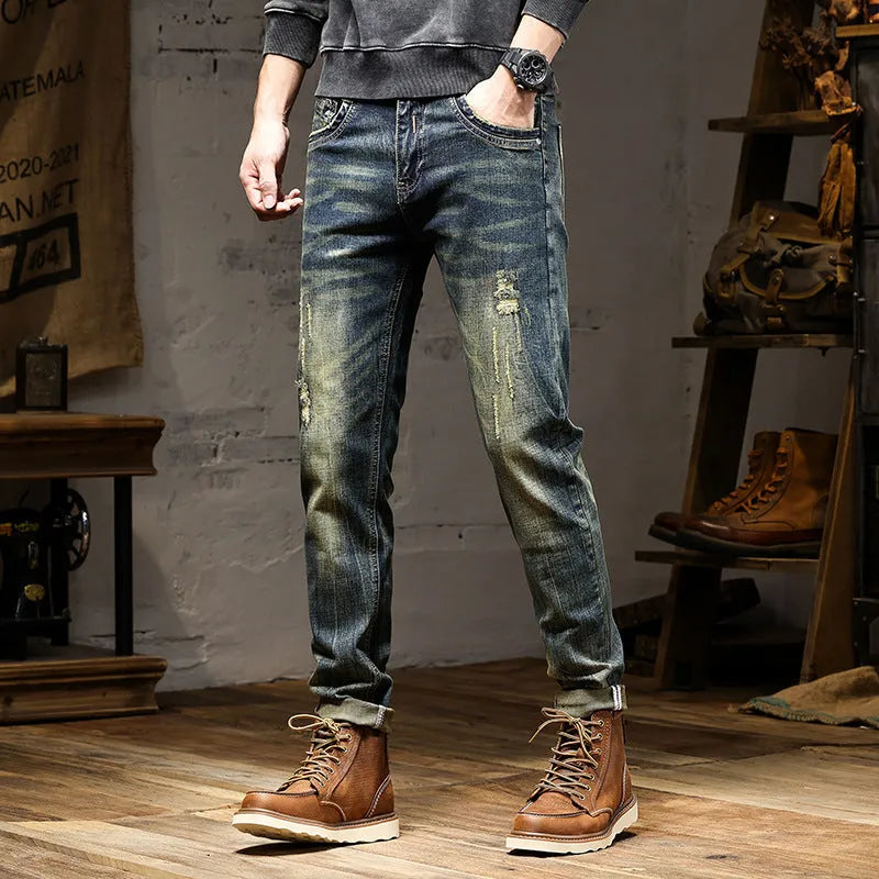 Men's skinny fit retro colour jeans with a zip fly, laid flat.