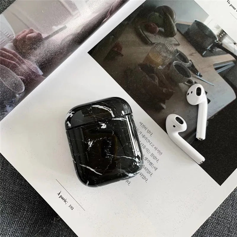 White marble protective case for Apple AirPods charging box showing hard PC construction