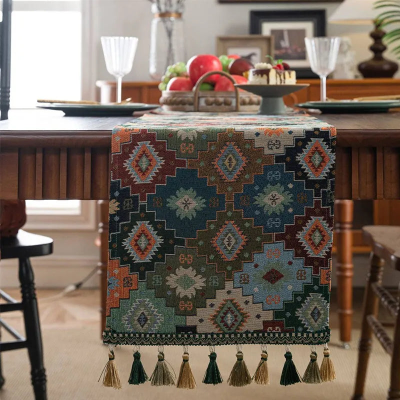 Dark blue Nordic jacquard table runner with bouquet pattern and tassel fringe on wooden table