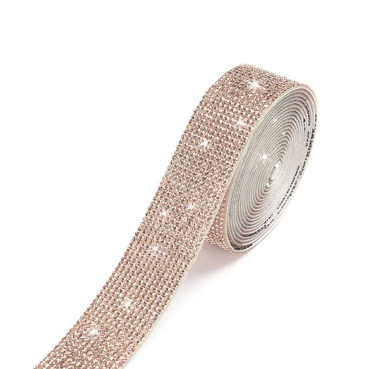 A one-yard long self-adhesive electroplated glass rhinestone strip on a roll, shown in white and AB colour variants.