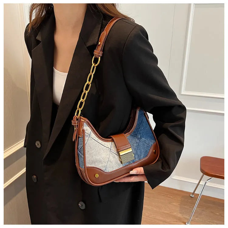 Brown denim bucket shoulder bag with diamond mesh pattern and chain decorative elements