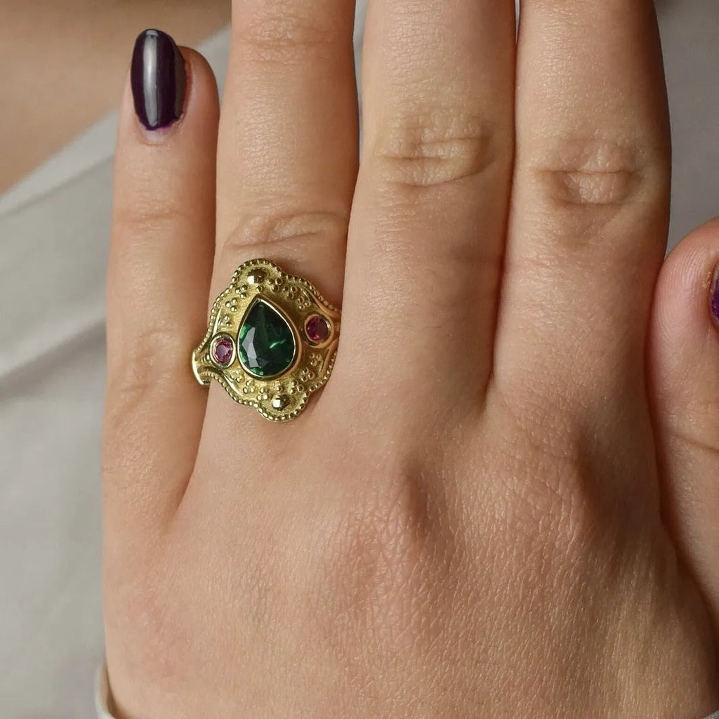 Gold-plated geometric ins style women's ring in golden lvzuan colour on a white background.