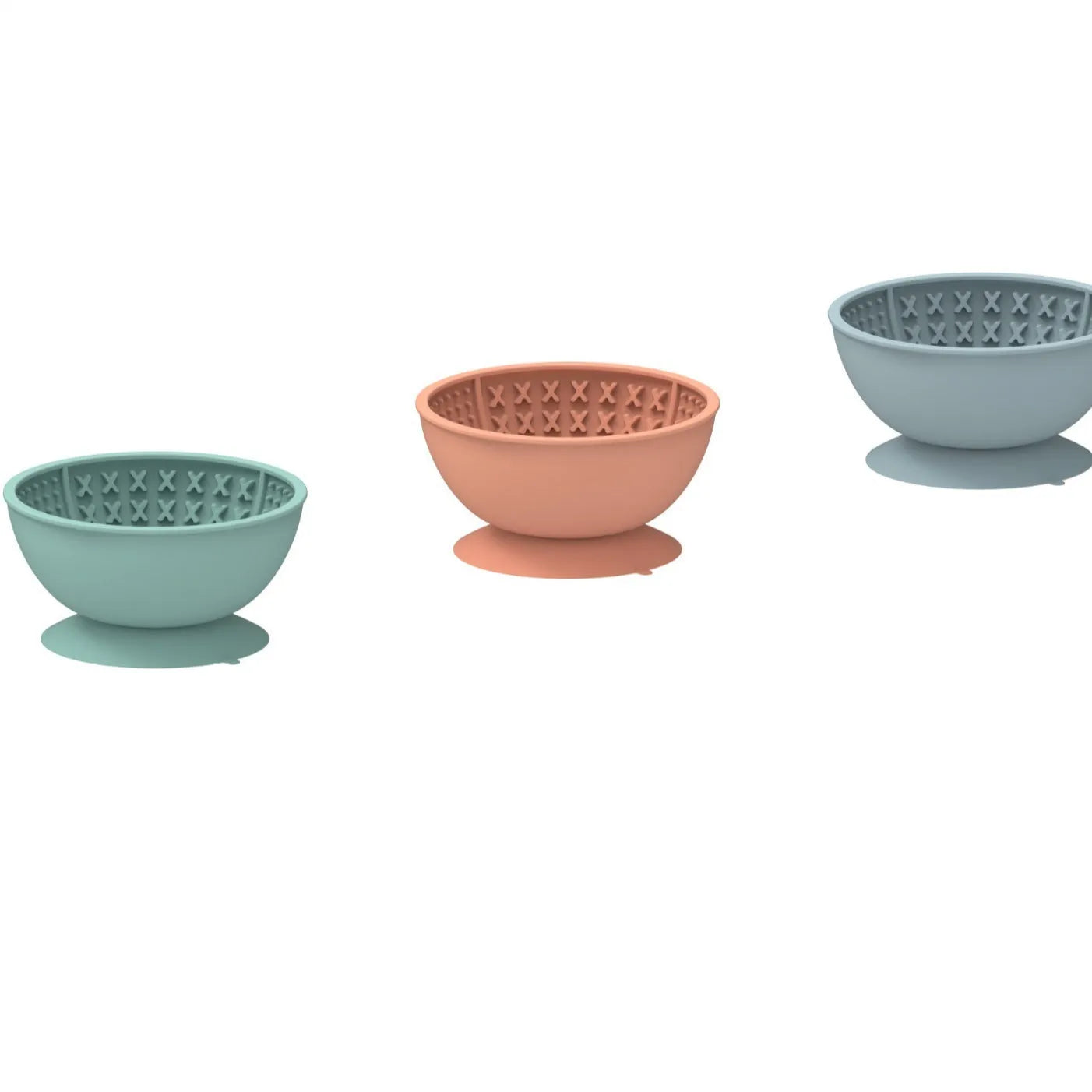 Cyan silicone dog bowl with slow feeder ridges and suction cup base on a table.