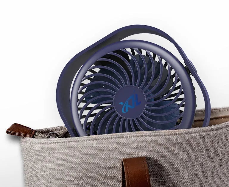 USB desk fan with rotating head in modern alarm clock design on desk