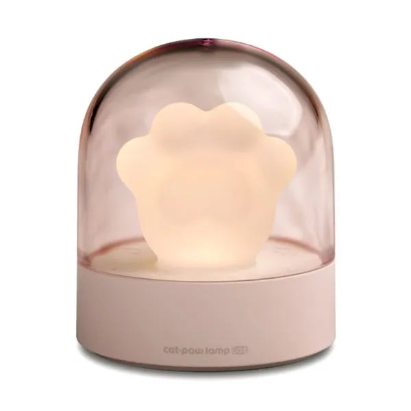 Grey cat paw USB night light with rotating illumination and music box function on wooden desk