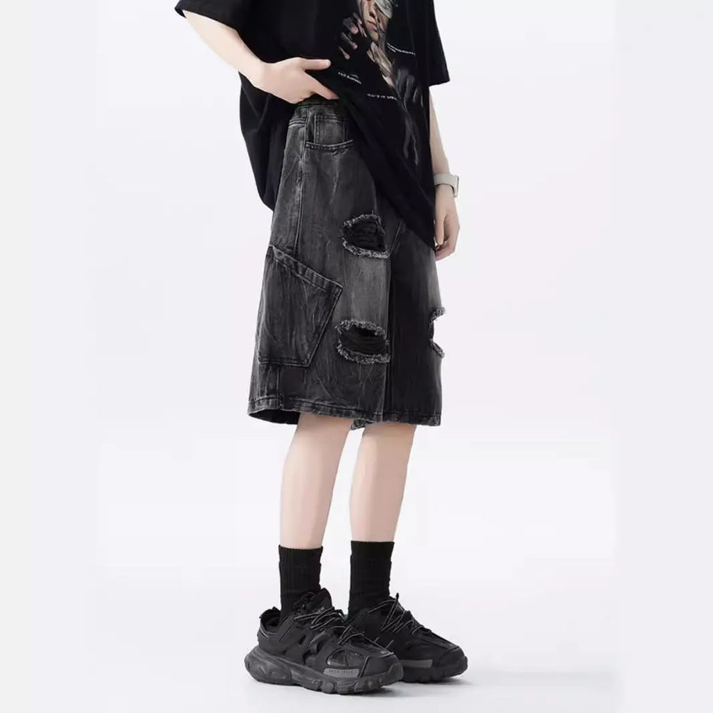 Washed denim shorts with ripped detailing in loose retro style, available in black or blue