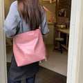 Corduroy tote bag with one-shoulder strap in pink colour showing structured dimensions and PU-lined interior