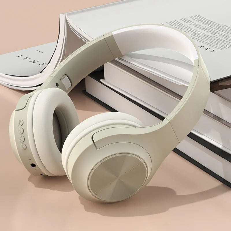 Wireless Bluetooth headset in ivory white, chalk black, or youth green colour, showing head-mounted design.