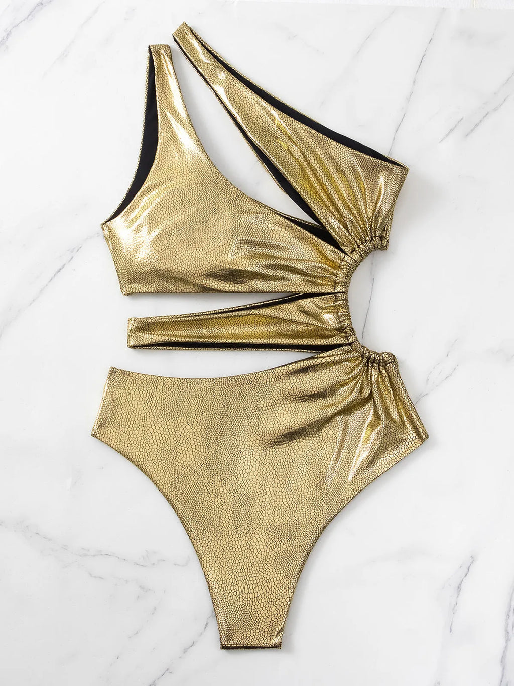 Women's gold backless one-piece swimsuit with sleeveless design on mannequin