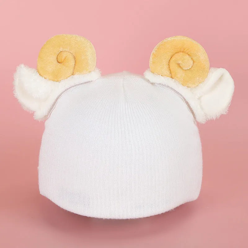 Cute plush cartoon animal character hat designed to decorate a standard ski helmet.