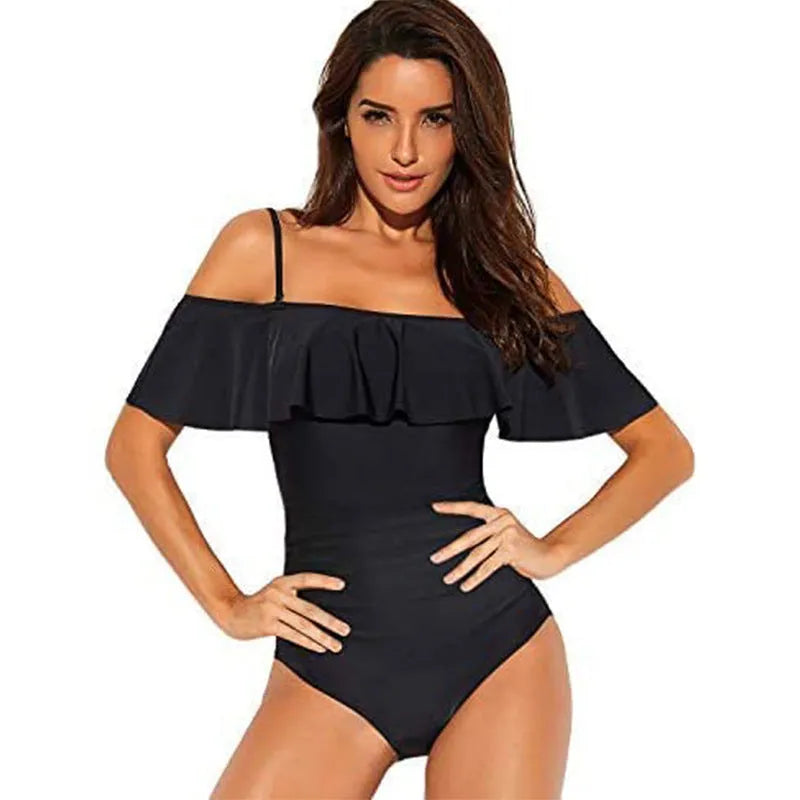 Black one-piece swimsuit with cut-out detail and ruffled straps on a mannequin.