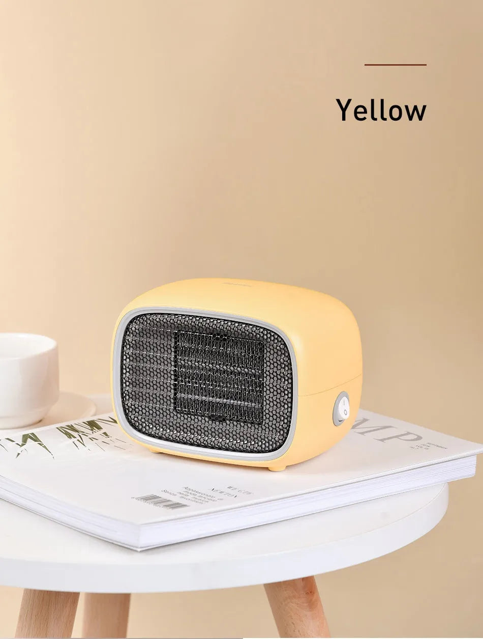 Mini ceramic desk heater in green colour showing compact dimensions