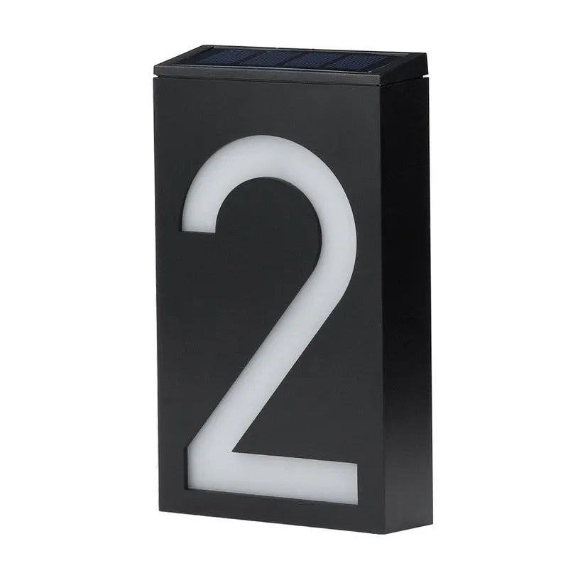 Solar powered house number light with white LEDs illuminating digit, IP65 waterproof outdoor design
