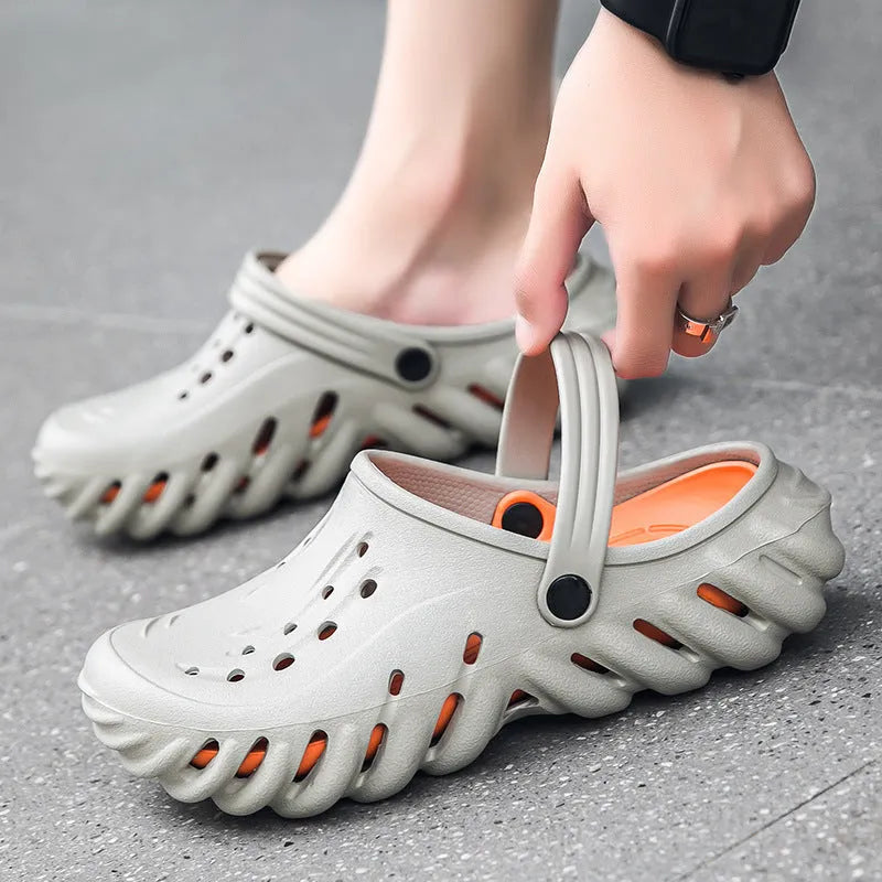 Men's beige EVA slipper sandals with hollow-out design and non-slip sole, shown from the side.