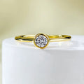 Minimalist silver crown ring with line design in gold or platinum finish on a size guide