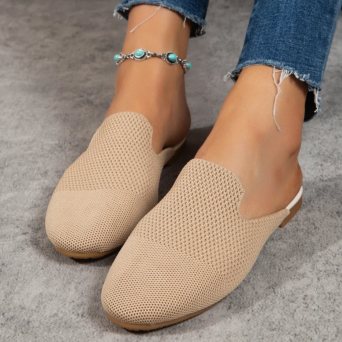 Mesh sandals in apricot, blue, and green colours showing cloth upper and flat rubber sole.