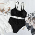 Black women's high-waist bikini with sling split design on shorts and sleeveless top.