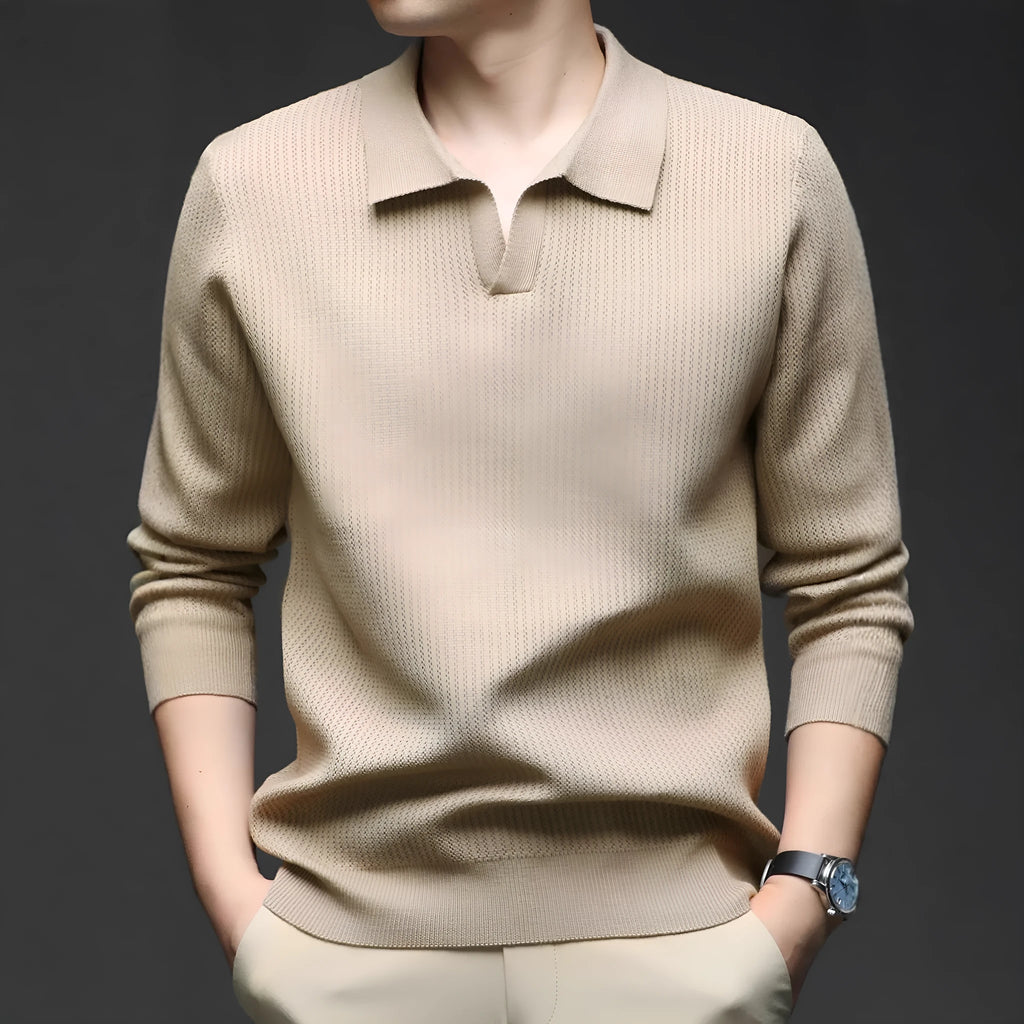 A man's loose-fitting casual pullover jumper in a neutral colour, shown on a model.