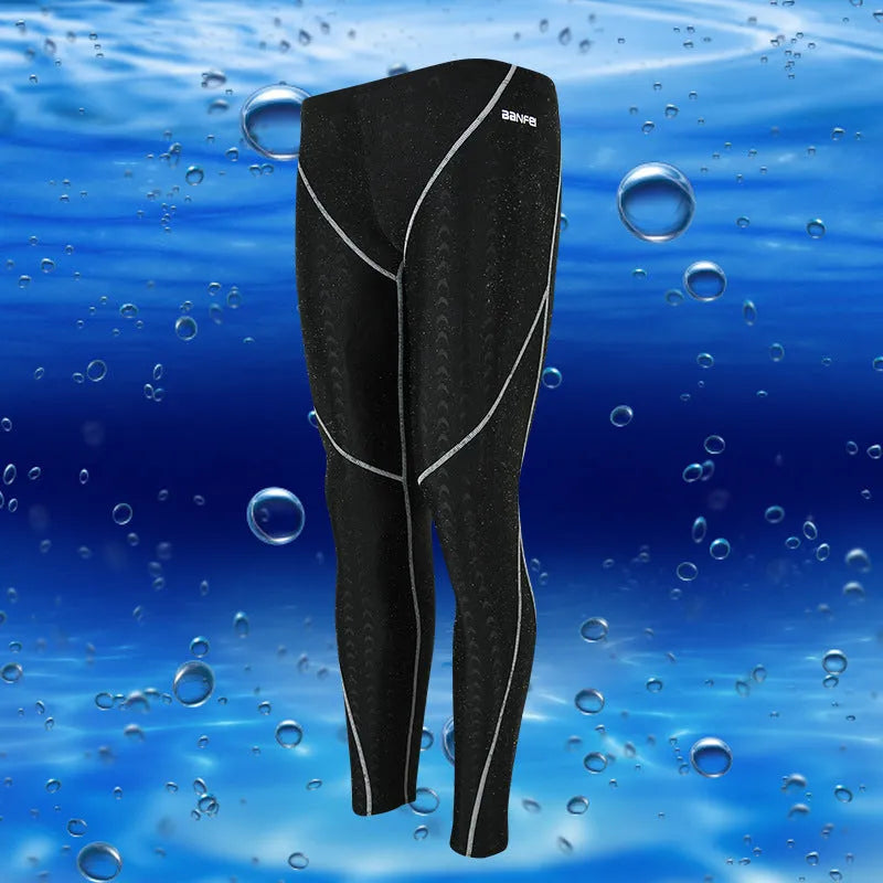 Men's black cropped nylon swimming trunks with mesh lining, shown on size chart