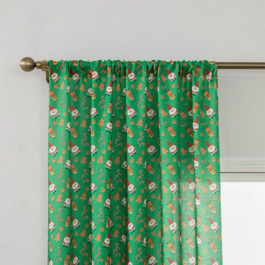 Christmas curtain with snowman and angel cartoon print in green, 1 metre length.