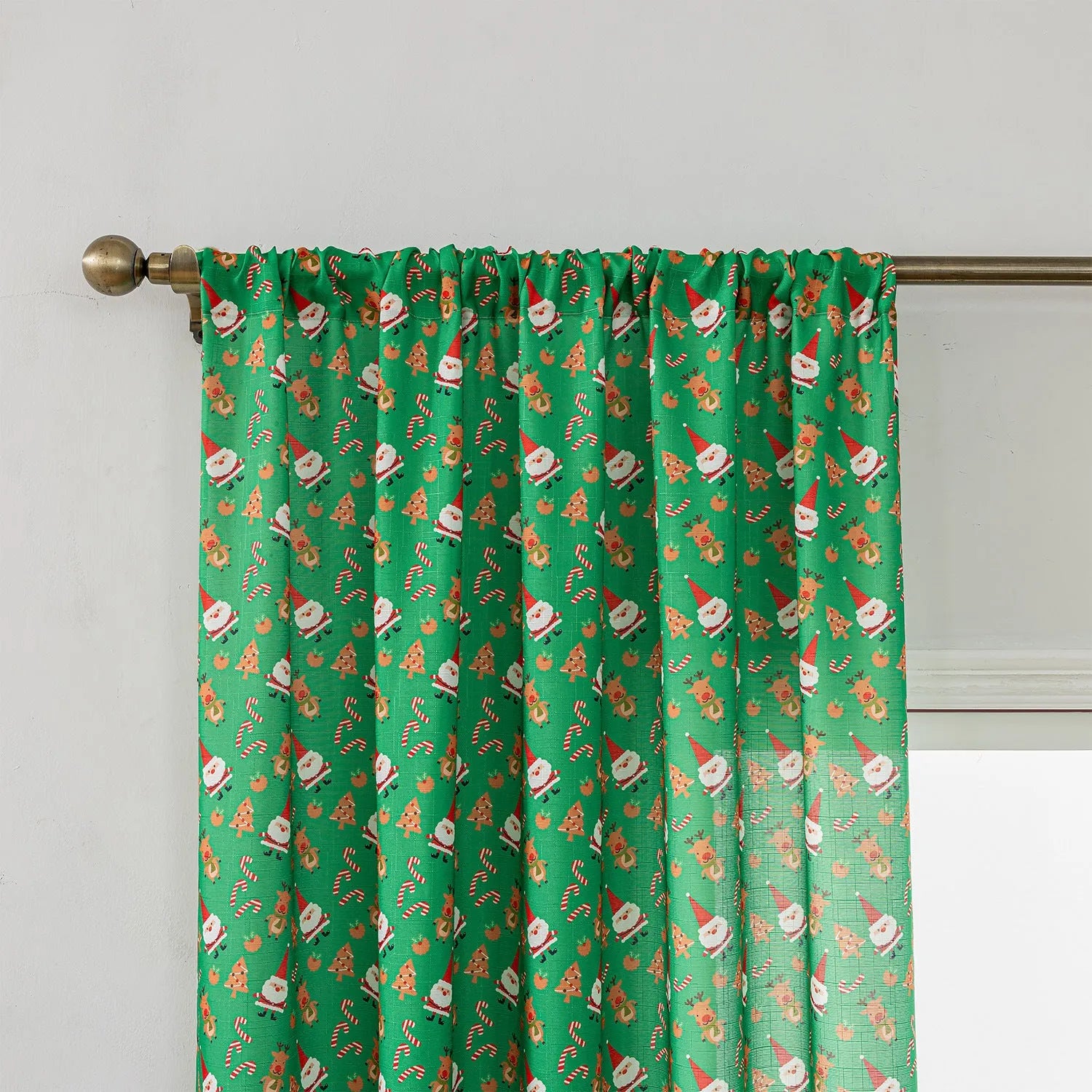 Christmas curtain with snowman and angel cartoon print in green, 1 metre length.