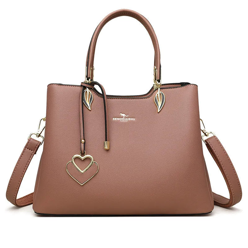 Women's black PU leather multi-compartment shoulder messenger bag with adjustable strap.