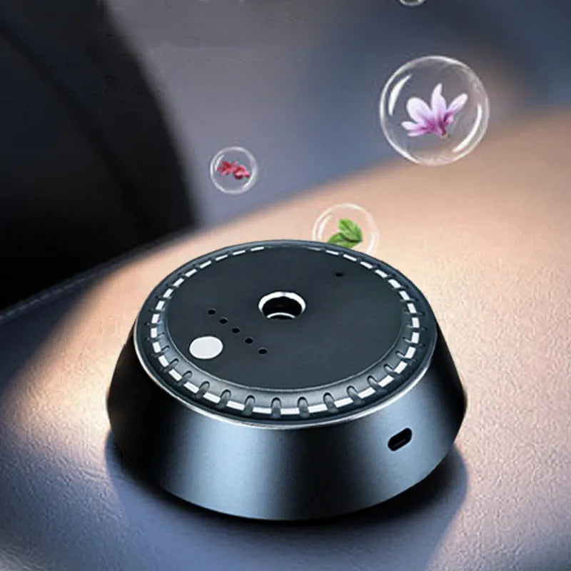 Black metal car aroma diffuser measuring 9cm by 4.5cm with USB charging port