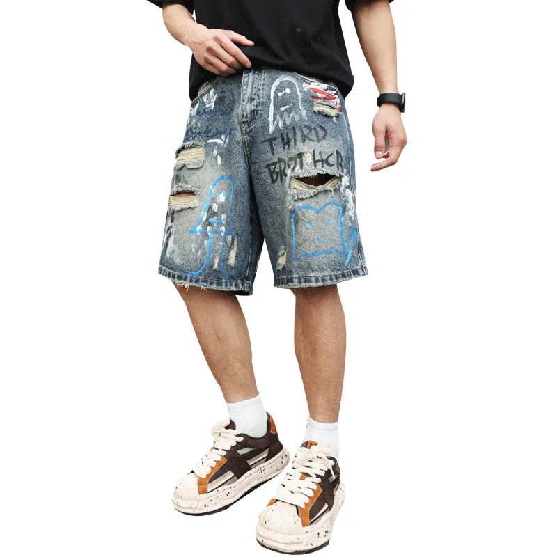 Men's blue ripped denim jeans shorts with graffiti print and straight leg design
