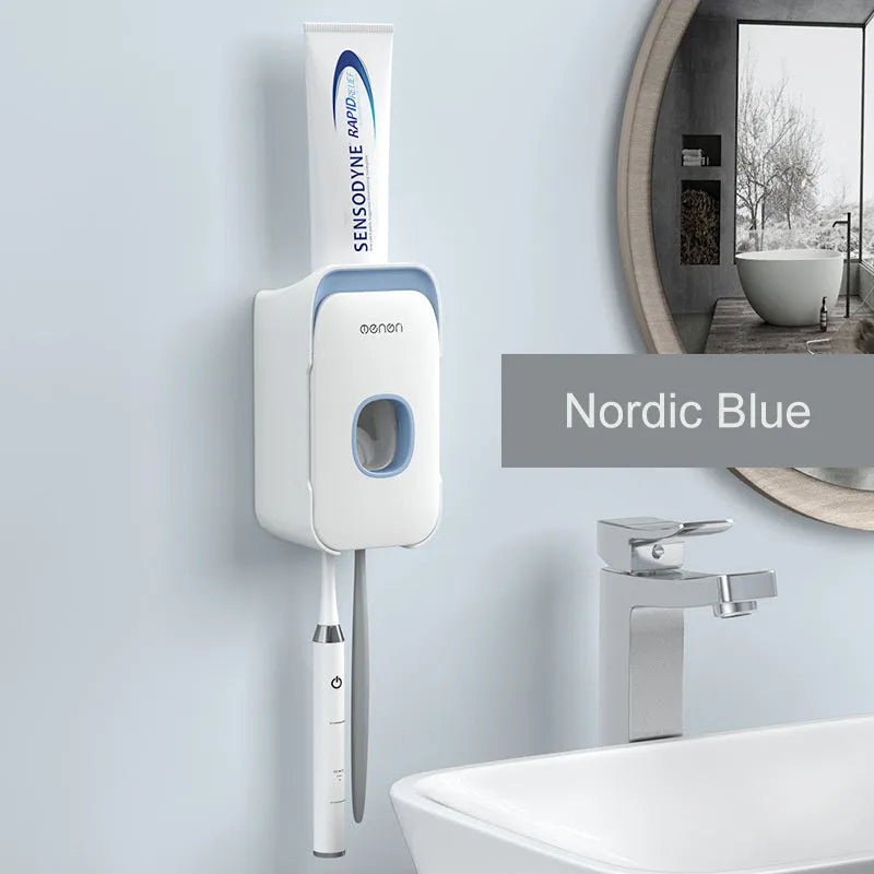 Blue automatic toothpaste dispenser made of ABS plastic on a bathroom shelf.