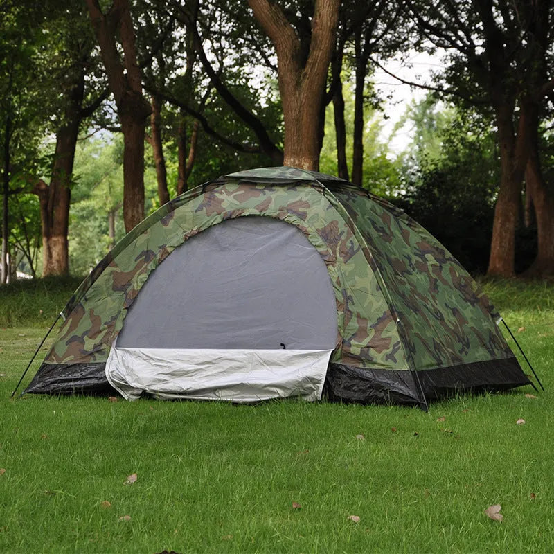 Green camouflage camping tent with mesh windows and steel ground pegs