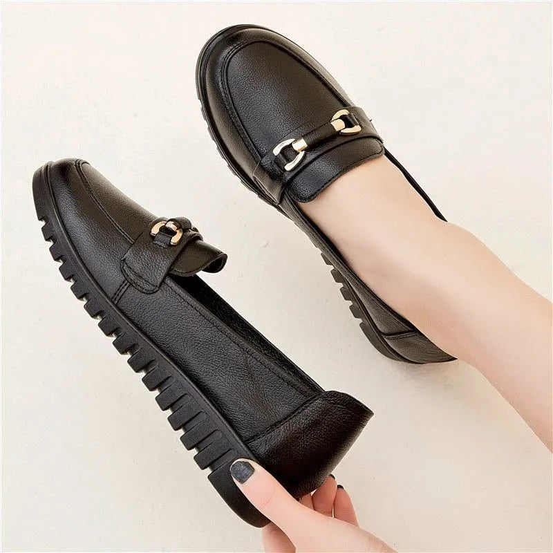 Black women's pumps with soft leather upper, low heel, and round toe casual shoes