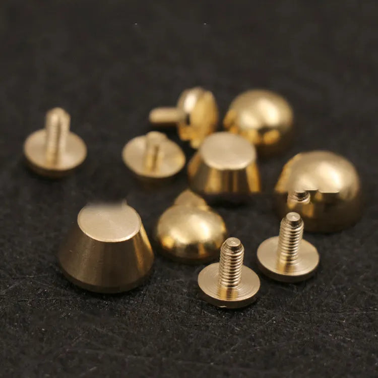 Brass decorative foot nail buckles in round and bucket shapes, sizes 10x6mm and 12x7mm.