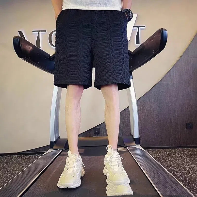 W120 Black loose straight-leg casual sports pants on model showing cotton blend fabric