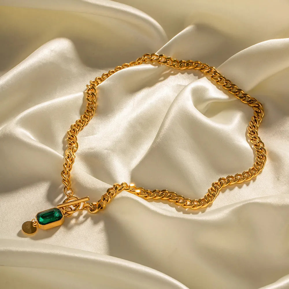 Gold electroplated titanium steel pendant necklace with geometric round design and Cuban link chain