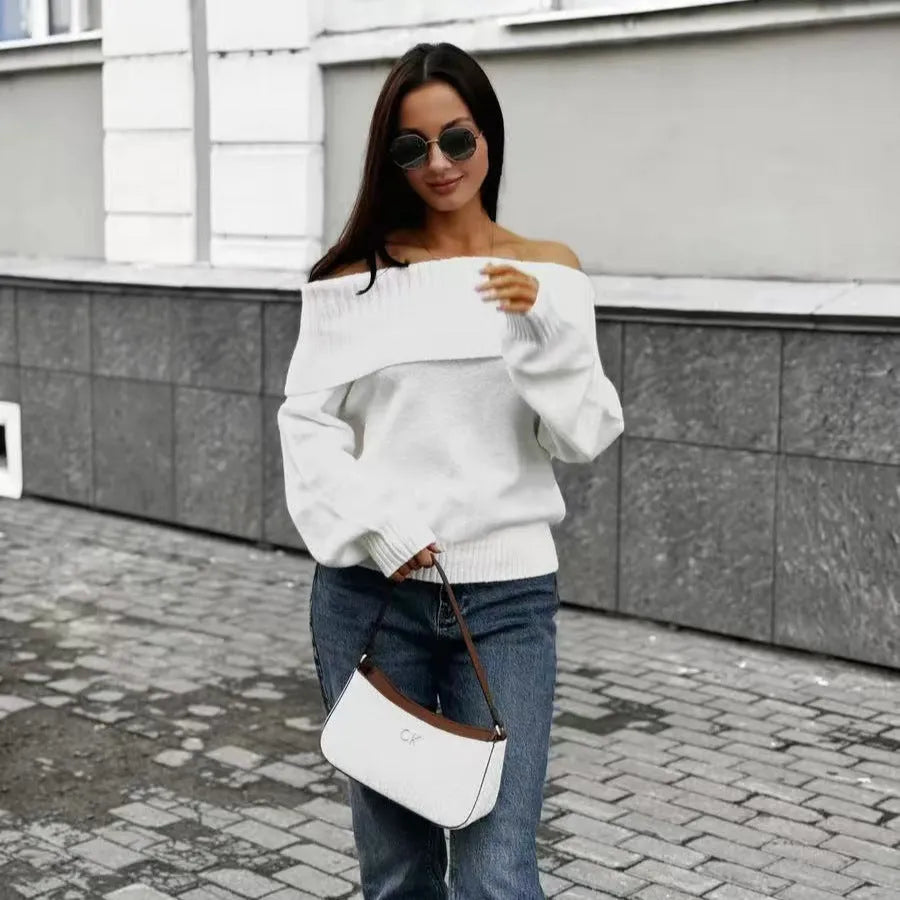 Grey off-the-shoulder strapless sweater with a 3D textured pattern and regular sleeves.
