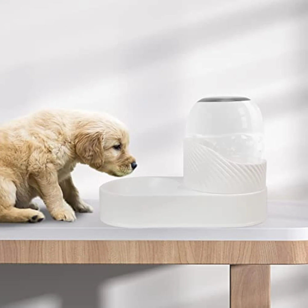 White automatic cat feeder and water dispenser set with wave-shaped design on a floor.