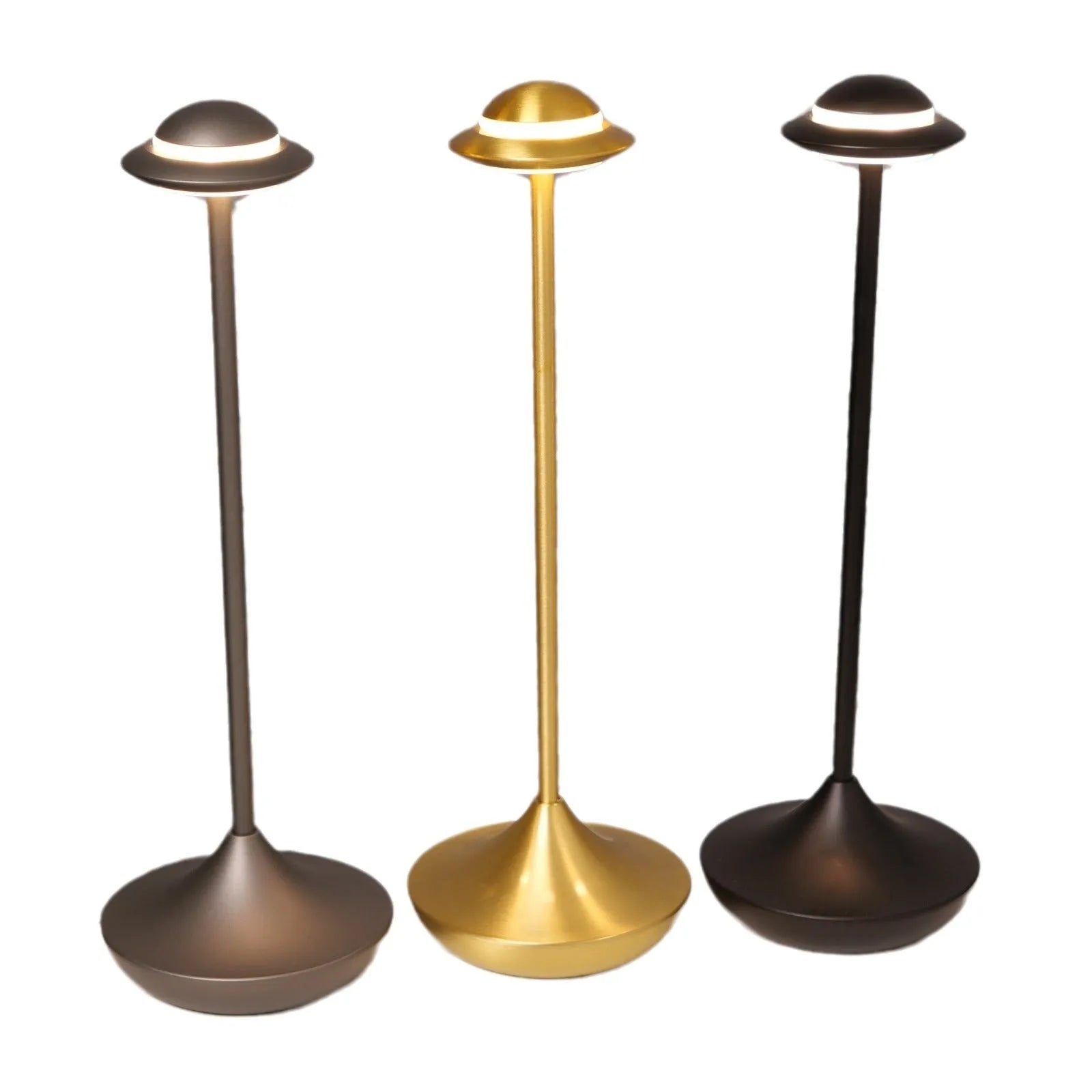 Creative metal UFO table lamp in black with touch dimming on a wooden desk.