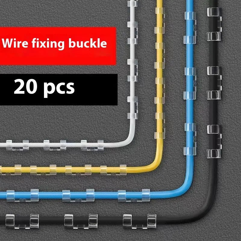 Transparent plastic self-adhesive cable clip holding a white wire against a wall.