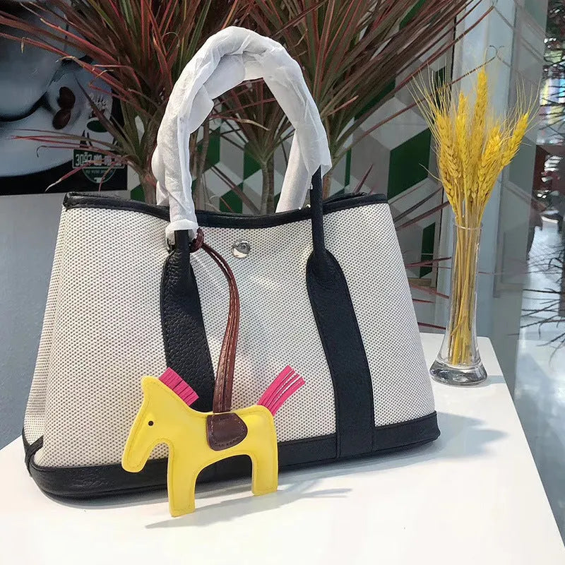 Women's canvas and leather crossbody bucket tote bag in multiple colour options