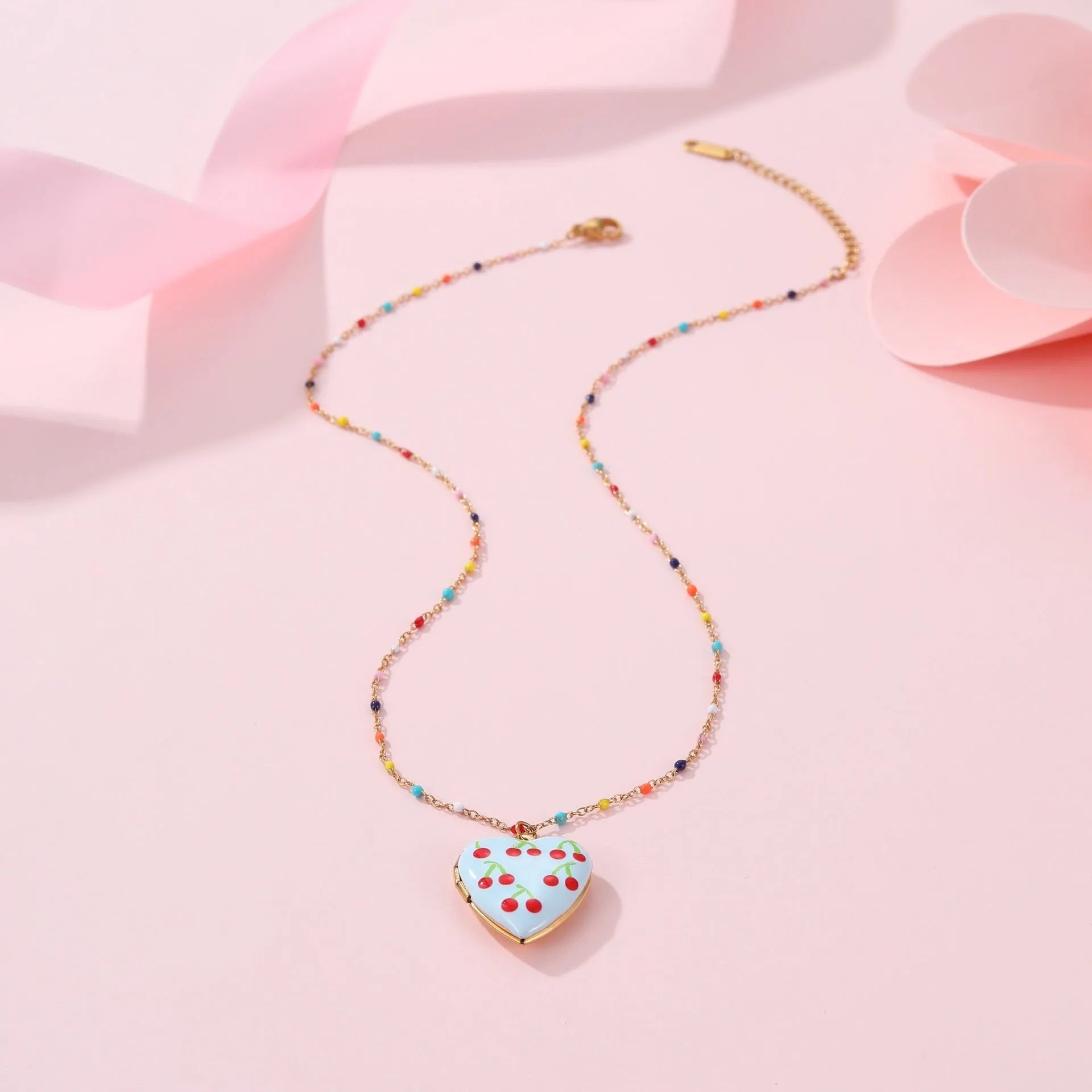 Women's stainless steel necklace with fruit pendant designs in gold plating on adjustable chain