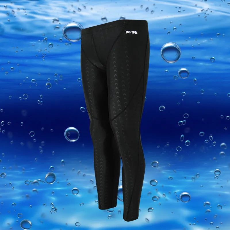 Men's black cropped nylon swimming trunks with mesh lining, shown on size chart