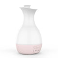 White ultrasonic aromatherapy diffuser with 200ml capacity and multicolour LED lighting on wooden table