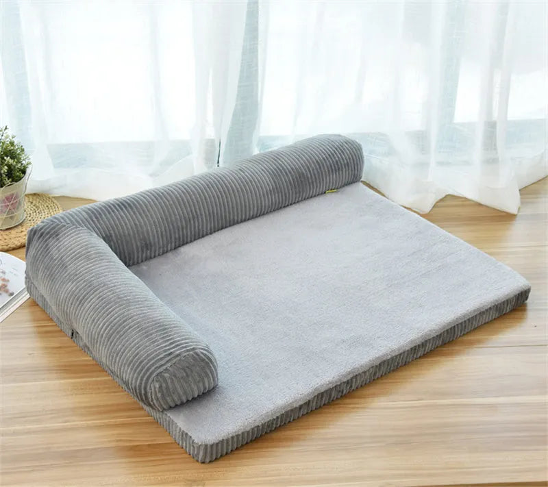 Corduroy bolster dog bed with non-slip base in grey, showing S M L XL size comparison.