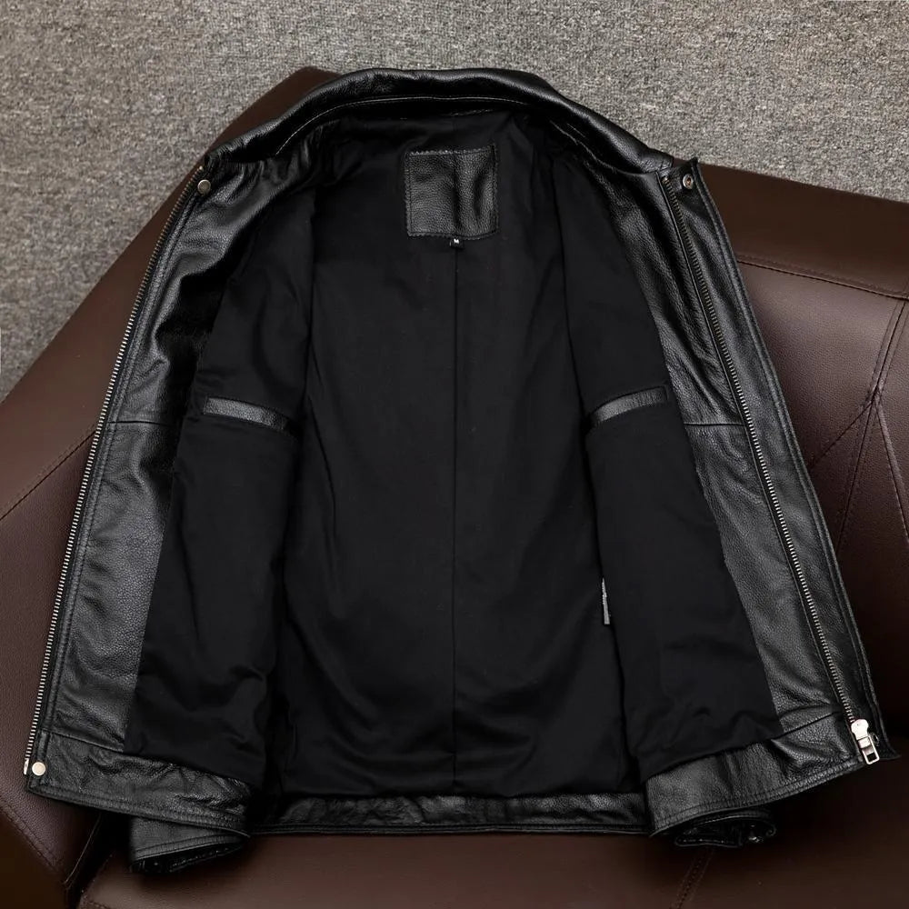 Man wearing a black loose-fit lapel PU leather jacket with side pockets.