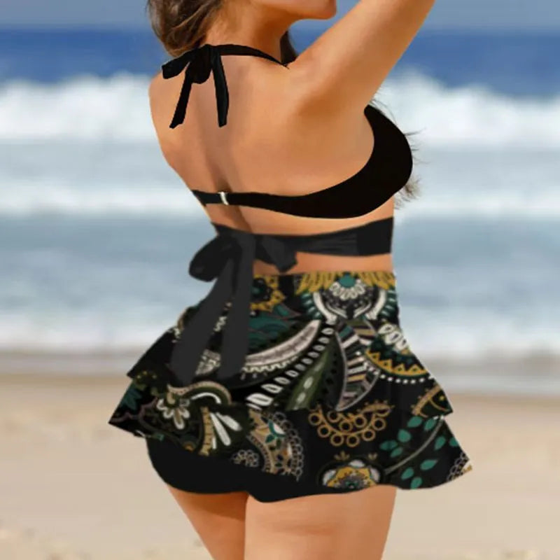 Purple women's lace-up bikini swimsuit set with a matching high-waisted skirt.