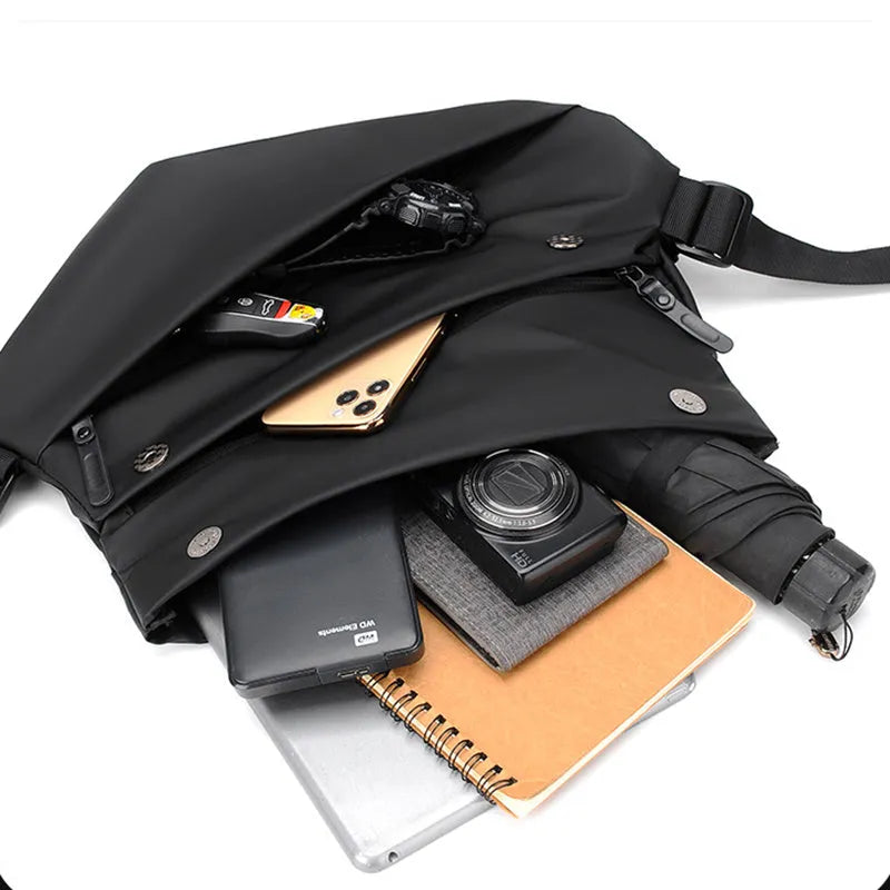 Men's grey medium crossbody sling bag showing internal phone and document compartments