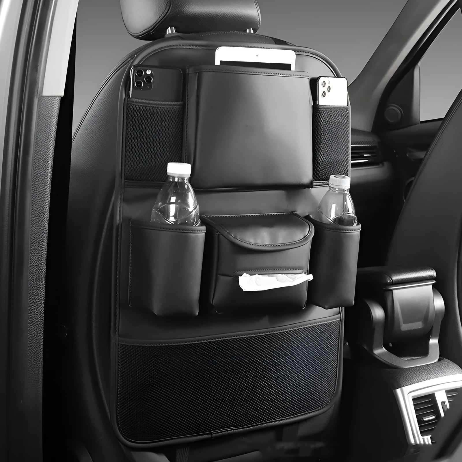 Leather car seat back storage bag in black, brown, green or grey colour hanging behind vehicle seat