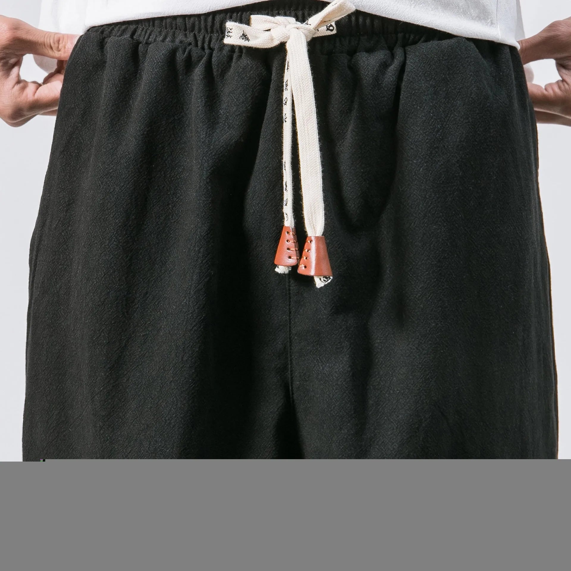 Men's black cotton hip hop streetwear joggers with drawstring waist and slant pockets